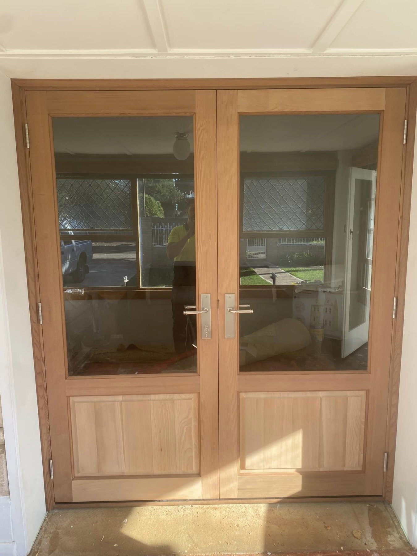 Federation-style timber double entry doors with glazed panels and brass hardware